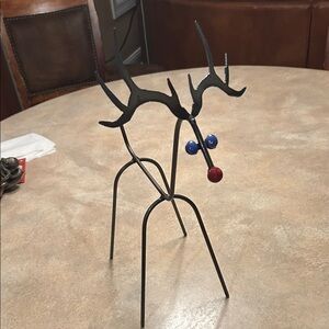 Black Metal Reindeer Sculpture with Red and Blue Accents